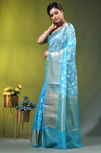 Elegant sky blue organza saree with white floral embroidery & rich golden zari border