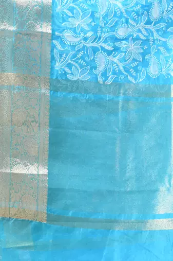 Elegant sky blue organza saree with white floral embroidery & rich golden zari border