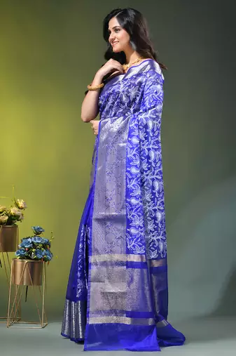 Elegant blue organza saree with white floral embroidery & rich golden zari border