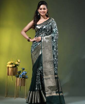 Elegant dark green organza saree with white floral embroidery & rich golden zari border 1
