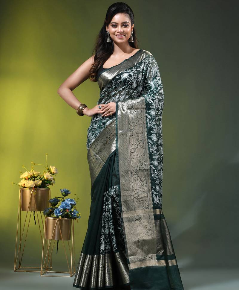 Elegant dark green organza saree with white floral embroidery & rich golden zari border