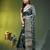 Elegant dark green organza saree with white floral embroidery & rich golden zari border