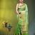 Elegant green organza saree with white floral embroidery & rich golden zari border