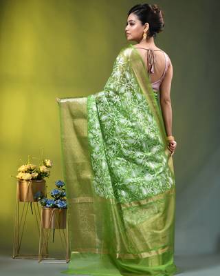 Elegant green organza saree with white floral embroidery & rich golden zari border 3