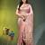 Elegant peach organza saree with white floral embroidery & rich golden zari border