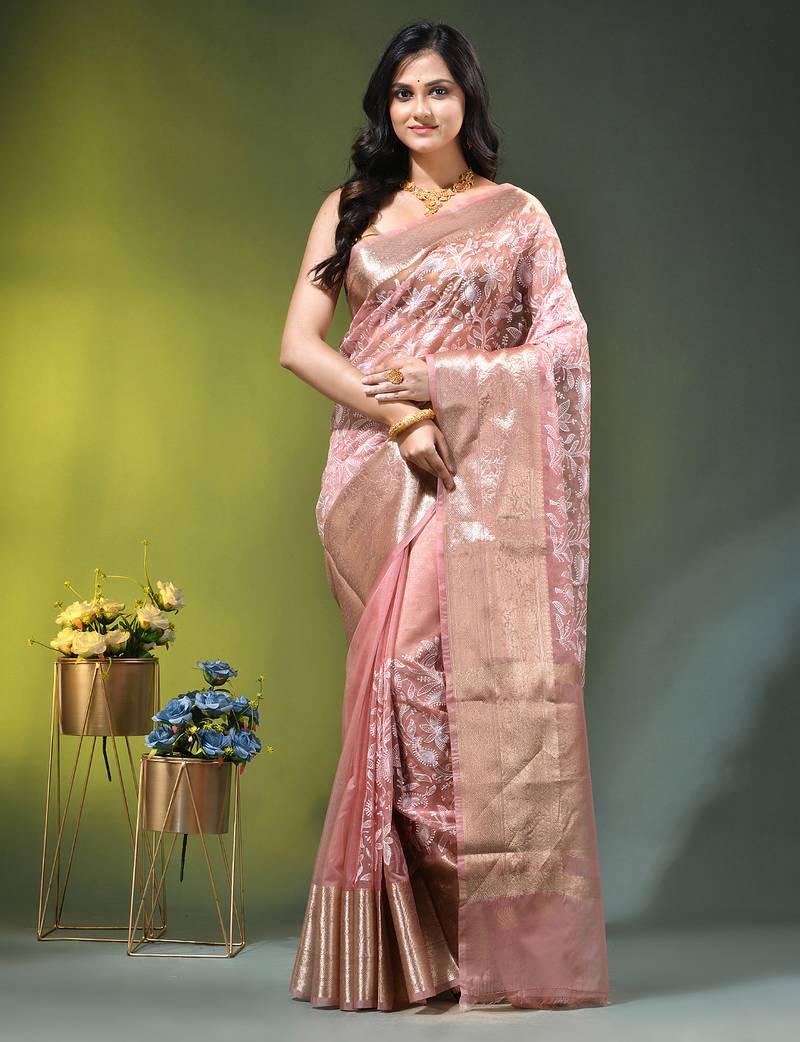 Elegant peach organza saree with white floral embroidery & rich golden zari border
