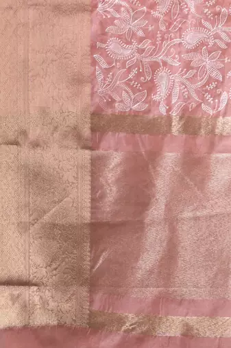 Elegant peach organza saree with white floral embroidery & rich golden zari border
