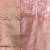 Elegant peach organza saree with white floral embroidery & rich golden zari border