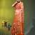 Elegant orange organza saree with white floral embroidery & rich golden zari border