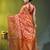 Elegant orange organza saree with white floral embroidery & rich golden zari border