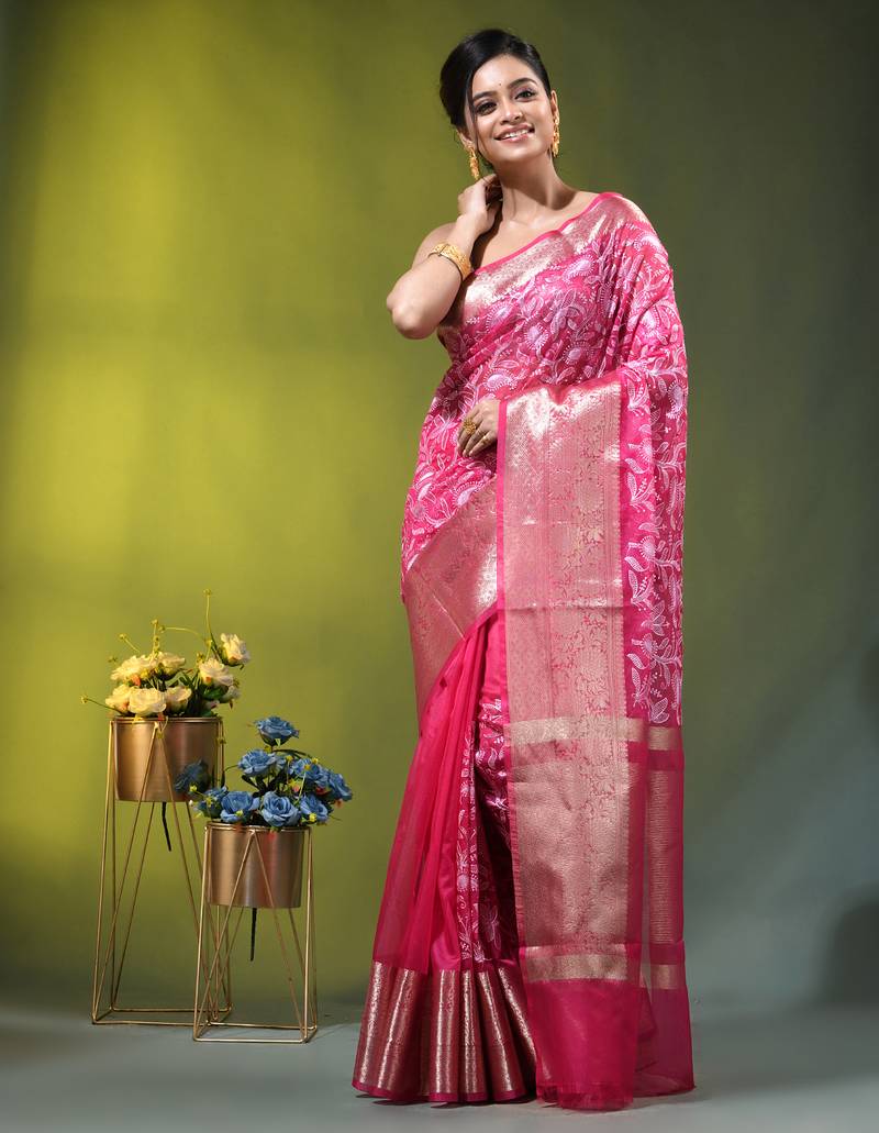 Elegant pink organza saree with white floral embroidery & rich golden zari border