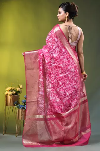 Elegant pink organza saree with white floral embroidery & rich golden zari border