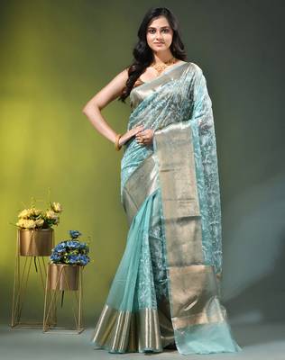 Elegant mint green organza saree with white floral embroidery & rich golden zari border 1