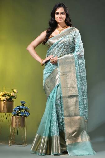 Elegant mint green organza saree with white floral embroidery & rich golden zari border