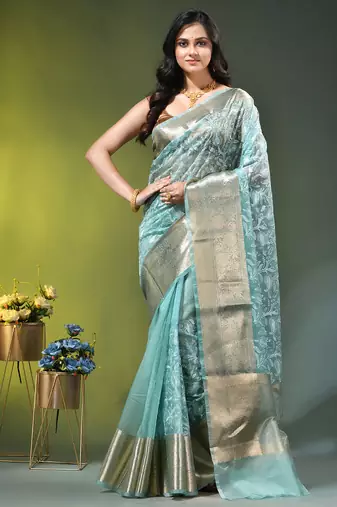 Elegant mint green organza saree with white floral embroidery & rich golden zari border