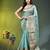 Elegant mint green organza saree with white floral embroidery & rich golden zari border