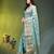 Elegant mint green organza saree with white floral embroidery & rich golden zari border