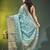 Elegant mint green organza saree with white floral embroidery & rich golden zari border