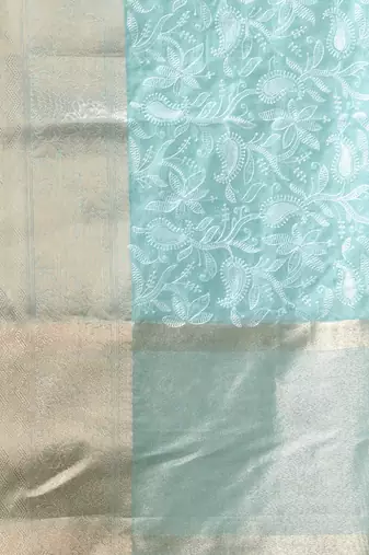 Elegant mint green organza saree with white floral embroidery & rich golden zari border