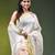 White linen saree with red floral woven design