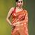 Elegant orange organza saree with white floral embroidery & rich golden zari border