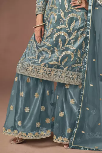 Sky blue net heavy thread embroidery, zari with sequins work salwar kameez