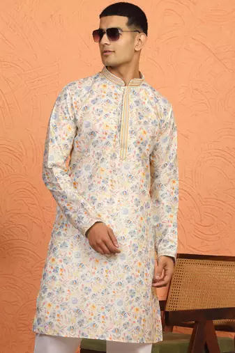 cream kurta featuring intricate floral patterns and mandarin collar