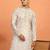cream kurta featuring intricate floral patterns and mandarin collar