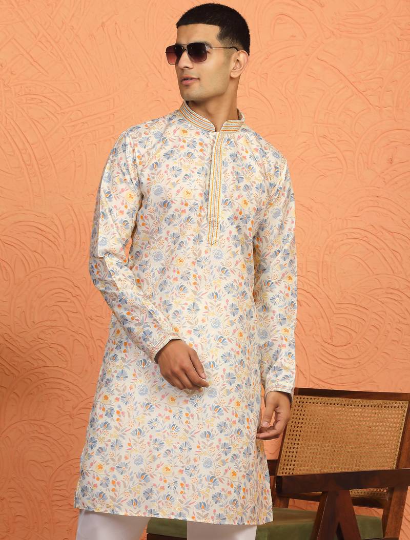 cream kurta featuring intricate floral patterns and mandarin collar