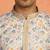 cream kurta featuring intricate floral patterns and mandarin collar