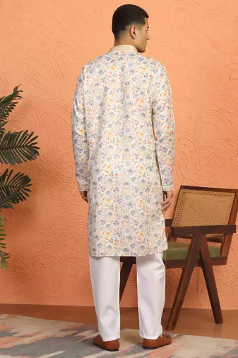 cream kurta featuring intricate floral patterns and mandarin collar