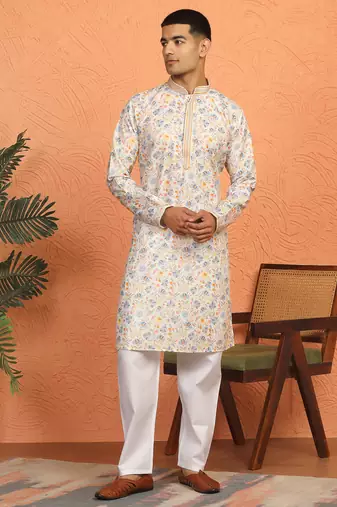 cream kurta featuring intricate floral patterns and mandarin collar