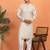 cream kurta featuring intricate floral patterns and mandarin collar
