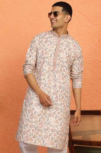 beige kurta featuring intricate floral patterns and mandarin collar