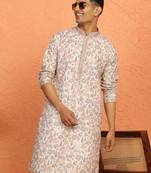 beige kurta featuring intricate floral patterns and mandarin collar