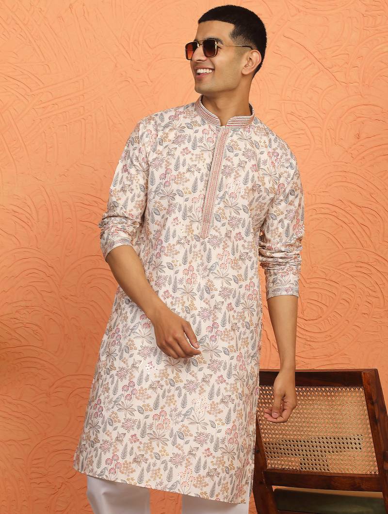 beige kurta featuring intricate floral patterns and mandarin collar