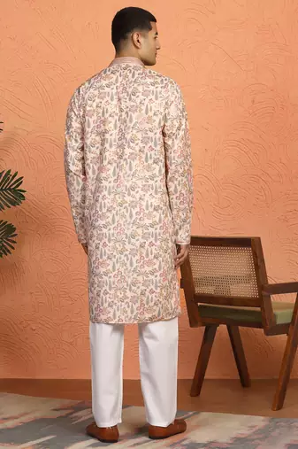 beige kurta featuring intricate floral patterns and mandarin collar