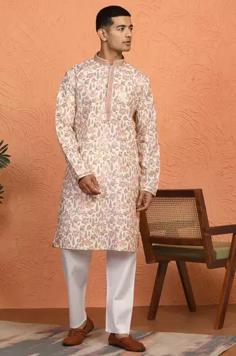 beige kurta featuring intricate floral patterns and mandarin collar
