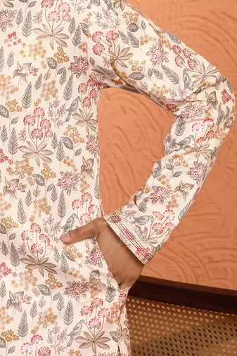 beige kurta featuring intricate floral patterns and mandarin collar