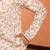 beige kurta featuring intricate floral patterns and mandarin collar