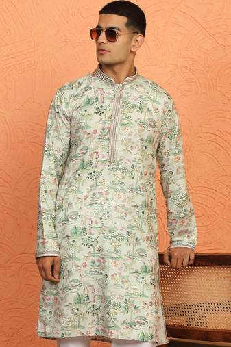 green kurta featuring intricate floral patterns and mandarin collar