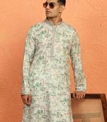 green kurta featuring intricate floral patterns and mandarin collar