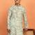 green kurta featuring intricate floral patterns and mandarin collar