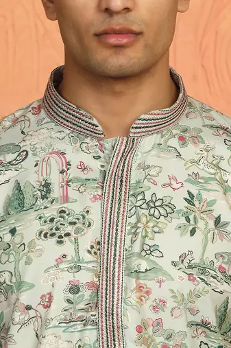 green kurta featuring intricate floral patterns and mandarin collar
