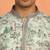 green kurta featuring intricate floral patterns and mandarin collar