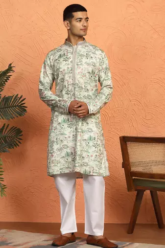 green kurta featuring intricate floral patterns and mandarin collar