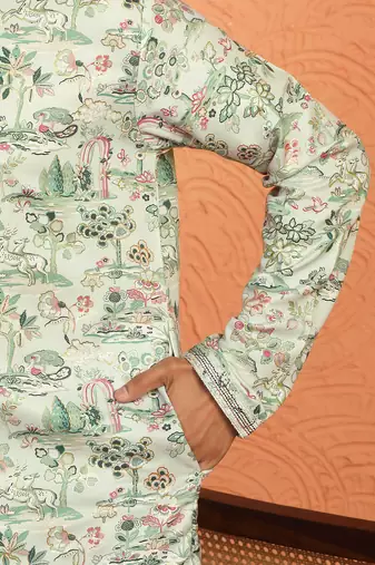 green kurta featuring intricate floral patterns and mandarin collar