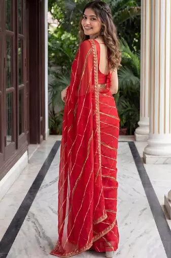 Red woven design zari leheriya saree with unstiched blouse