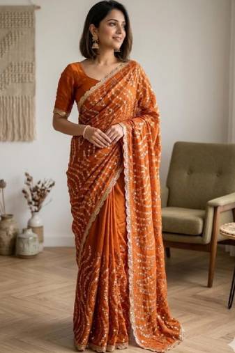 Embellished sequinned heavy work leheriya saree