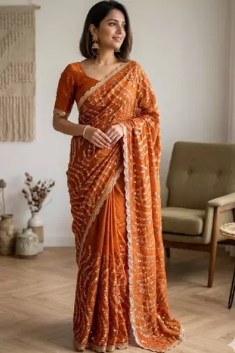 Embellished sequinned heavy work leheriya saree